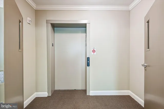 a front view of a house with a yard table and chairs