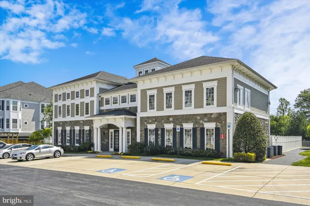 a living room with fireplace furniture and a chandelier