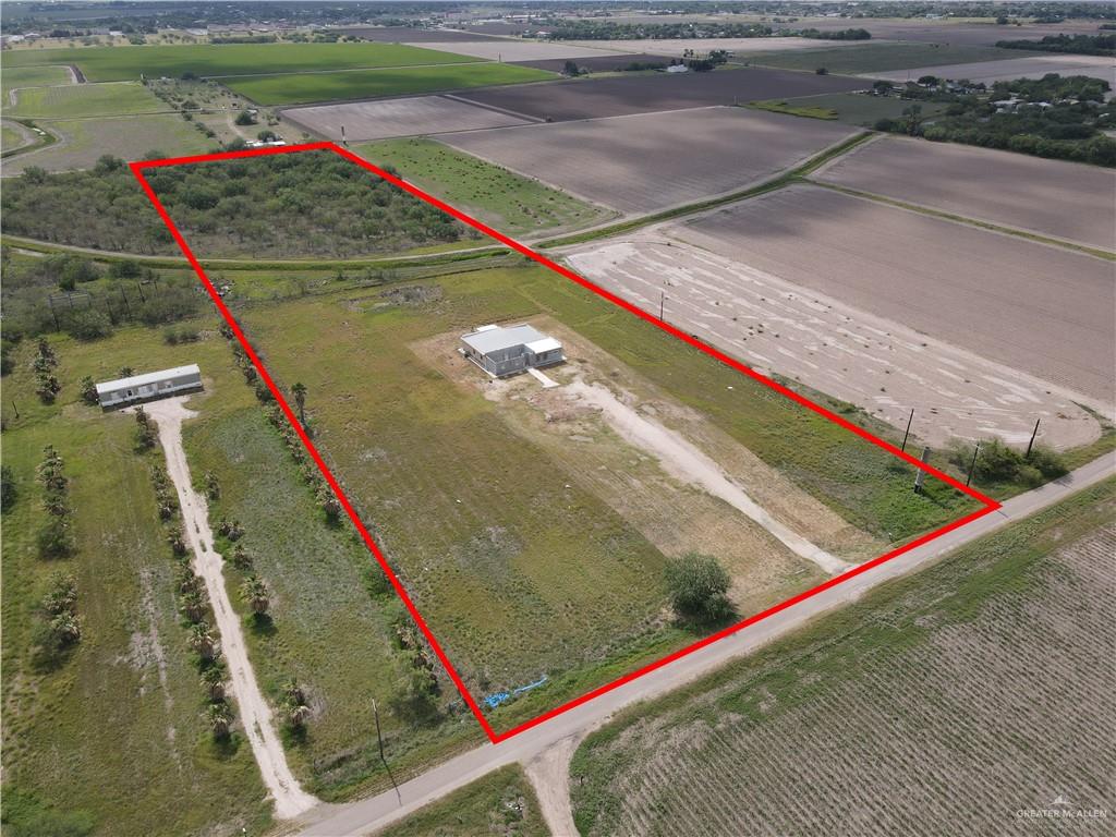 1424 North Sky Soldier Road Weslaco, TX 78596 - Photo 29 of 33 a view of a tennis ground with a large tree