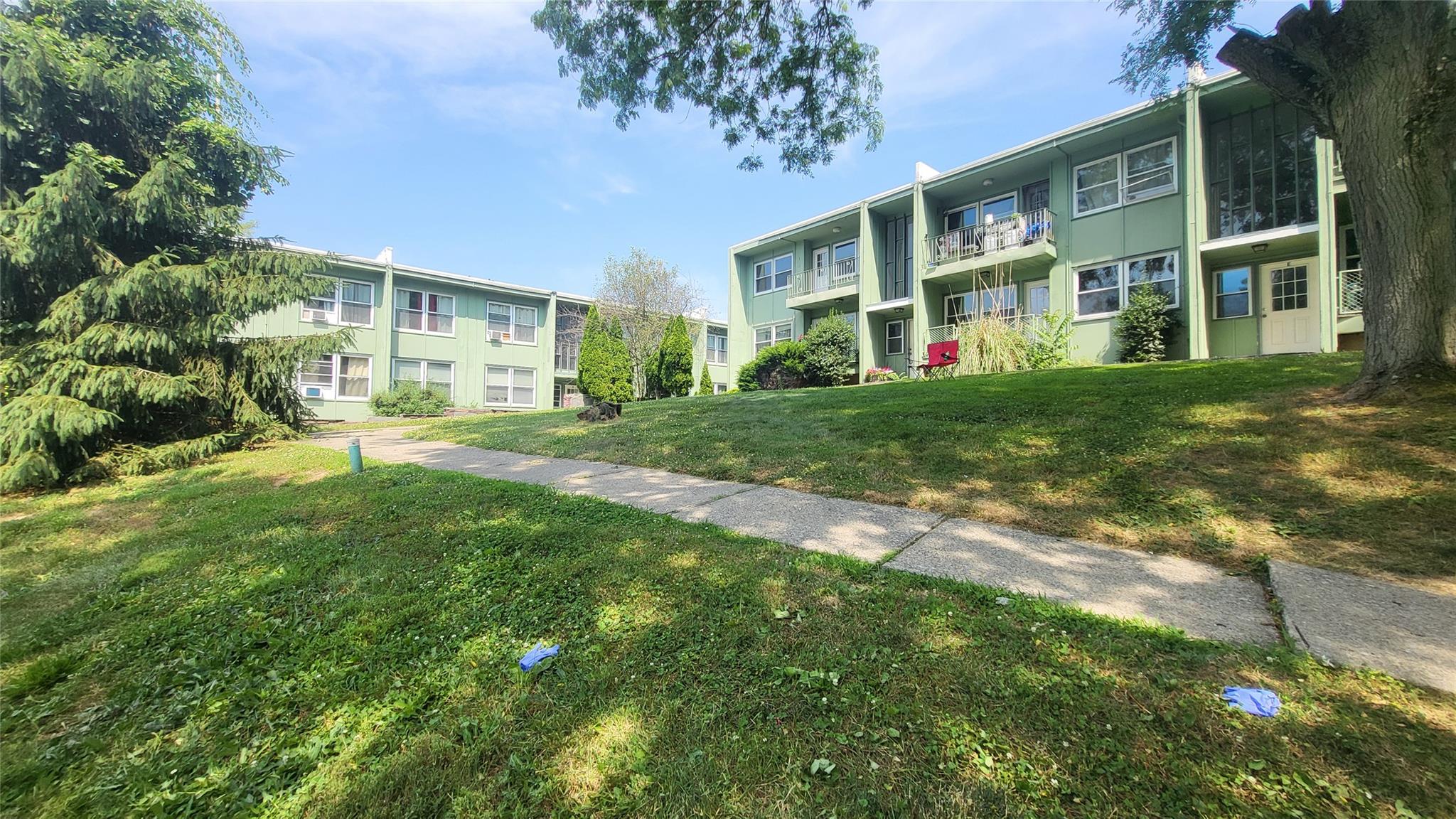 3726 Albany Post Road, Unit A3 Hyde Park, NY 12538 - Photo 1 of 1 a view of a big yard and front of a building