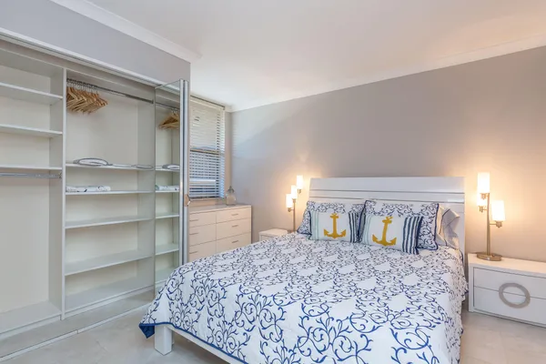 a bedroom with a bed and a cabinets