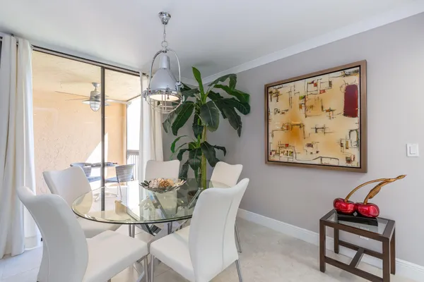 a dining room with furniture and window
