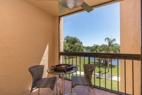a view of a balcony with furniture