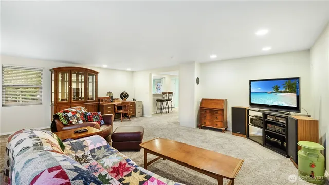 a kitchen with stainless steel appliances a refrigerator and microwave