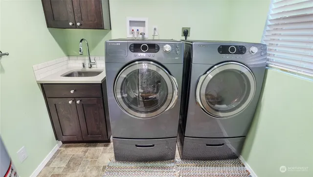 an aerial view of a house with swimming pool garden and patio