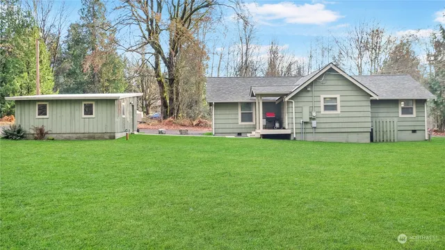 a backyard of a house with lots of green space