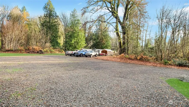 a backyard of a house with lots of green space