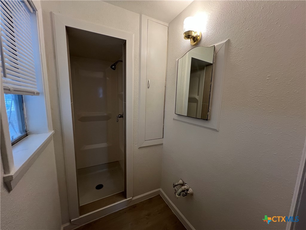 1009 Oak Street Refugio, TX 78377 - Photo 14 of 22 a bathroom with a shower