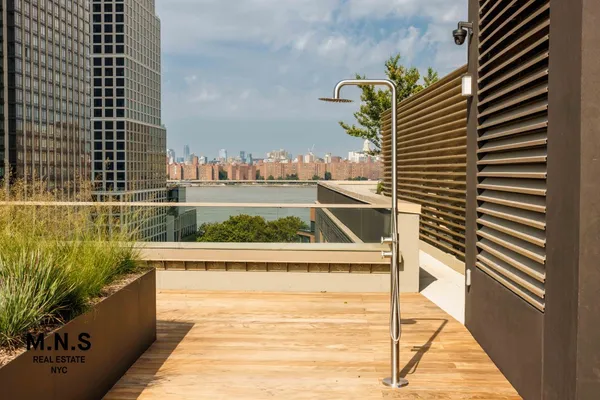 a view of balcony with chairs and wooden floor