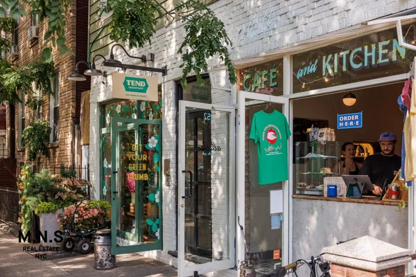 a view of path along with retail shop and buildings