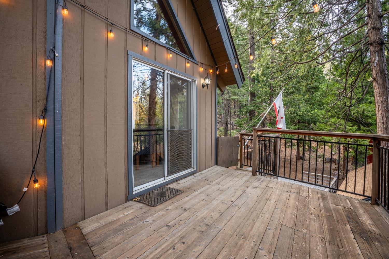 3790 Apache Road Arnold, CA 95223 - Photo 28 of 41 a view of backyard with a deck and wooden floor
