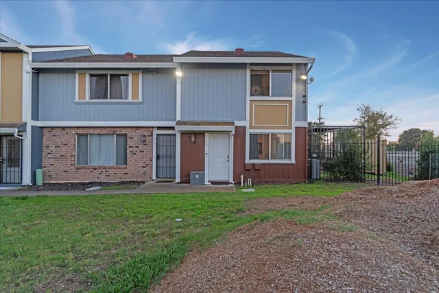 front view of a house with a yard