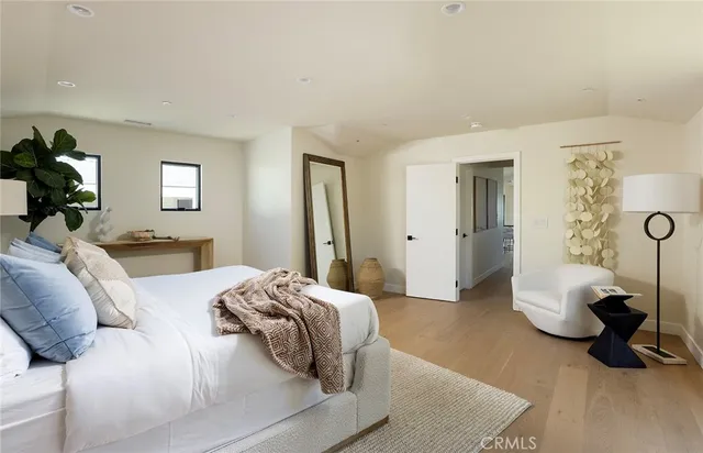 a bedroom with a bed and a couch