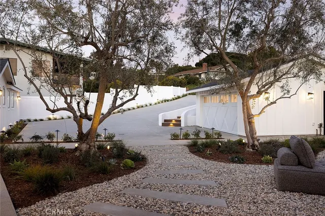 a view of backyard with large trees
