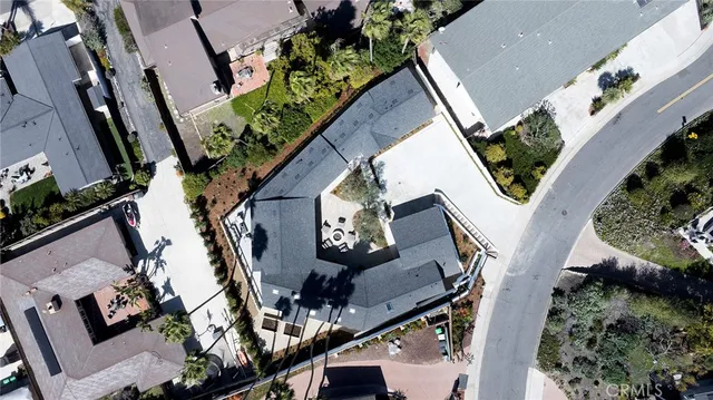 an aerial view of a house with outdoor space