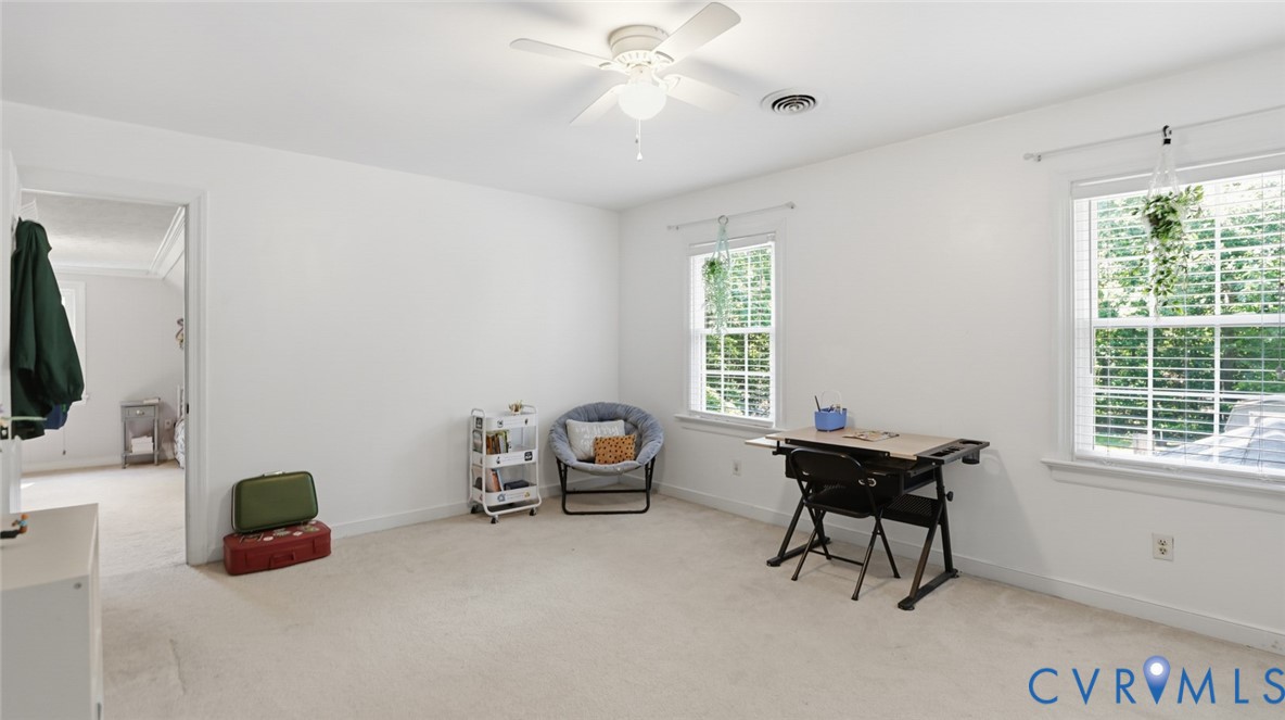 10716 Chalkley Road Richmond, VA 23237 - Photo 34 of 46 a living room with furniture and a window
