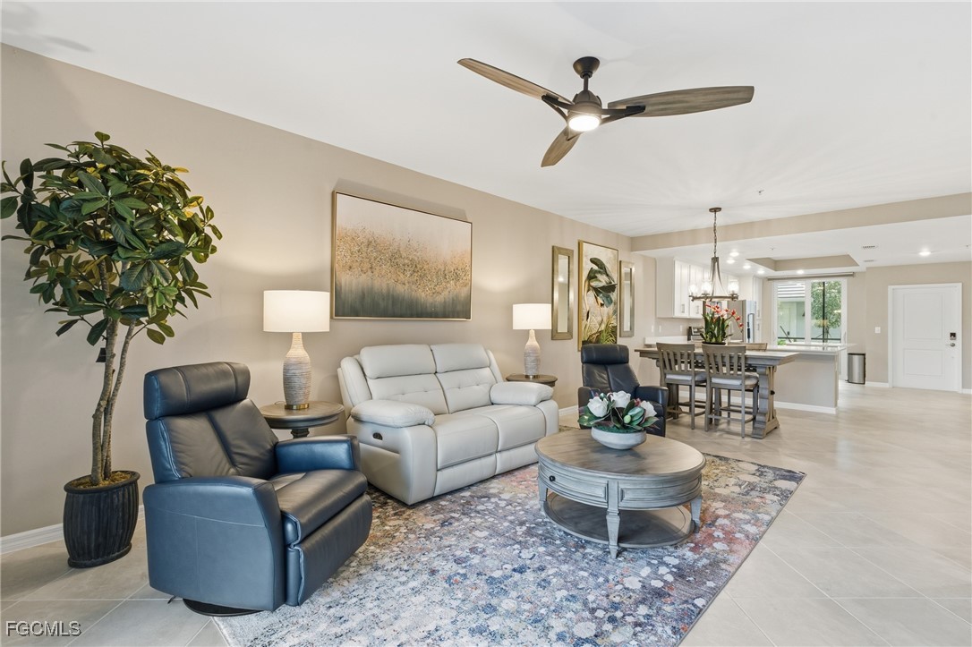 44000 Boardwalk Loop, Unit 1312 Punta Gorda, FL 33982 - Photo 1 of 48 a living room with furniture a chandelier and a potted plant