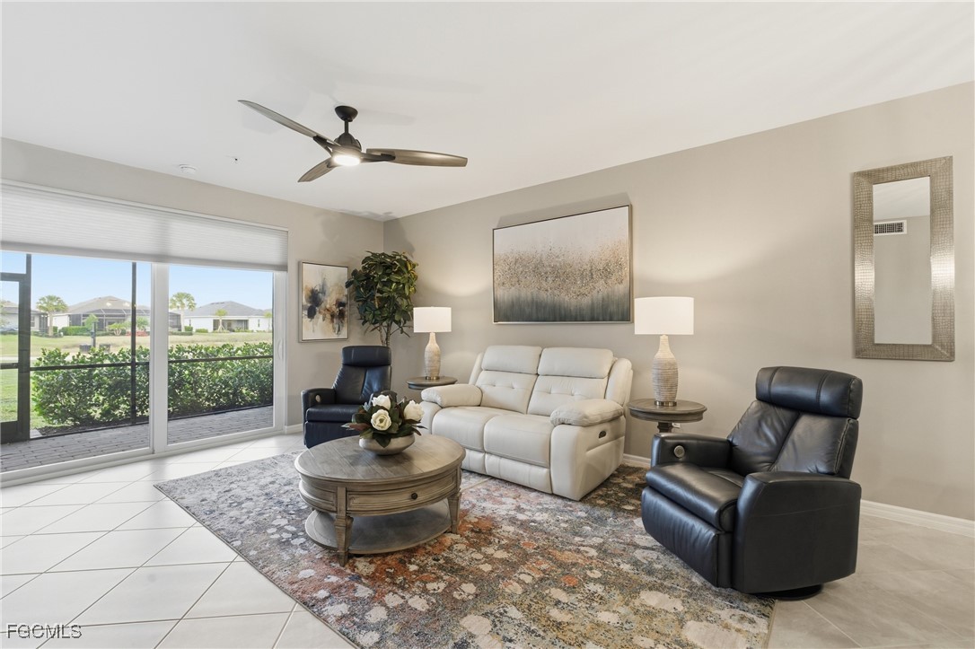 44000 Boardwalk Loop, Unit 1312 Punta Gorda, FL 33982 - Photo 11 of 48 a living room with furniture and a potted plant
