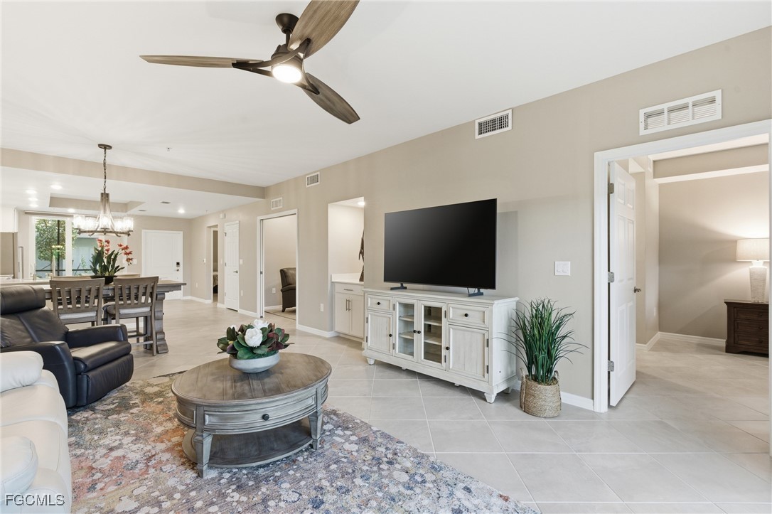 44000 Boardwalk Loop, Unit 1312 Punta Gorda, FL 33982 - Photo 12 of 48 a living room with furniture and a flat screen tv