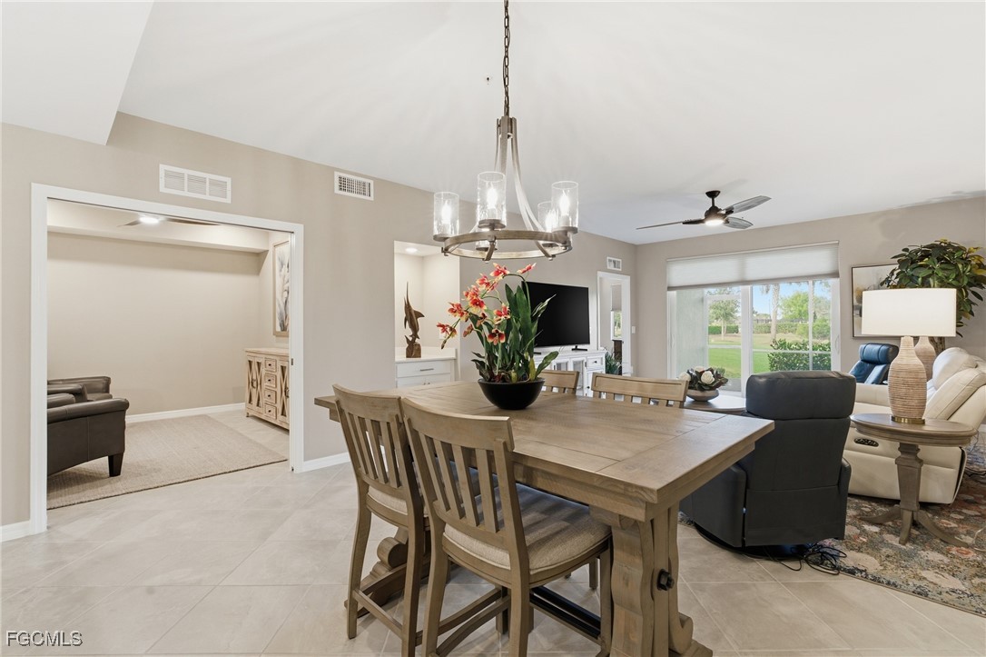 44000 Boardwalk Loop, Unit 1312 Punta Gorda, FL 33982 - Photo 15 of 48 a view of a dining room with furniture window and outside view