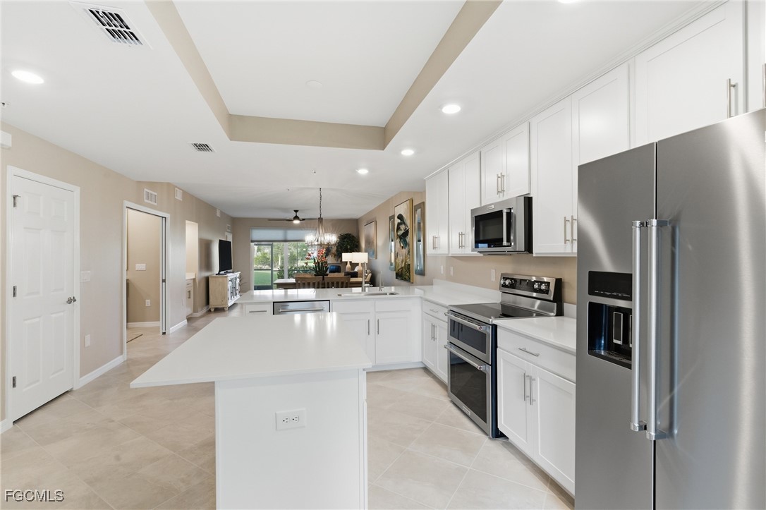 44000 Boardwalk Loop, Unit 1312 Punta Gorda, FL 33982 - Photo 19 of 48 a large kitchen with stainless steel appliances lots of counter top space