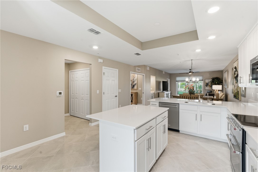 44000 Boardwalk Loop, Unit 1312 Punta Gorda, FL 33982 - Photo 20 of 48 a kitchen with a sink stove and cabinets