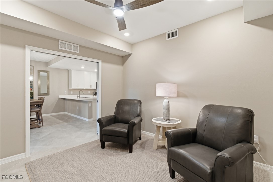 44000 Boardwalk Loop, Unit 1312 Punta Gorda, FL 33982 - Photo 23 of 48 a living room with furniture and a lamp