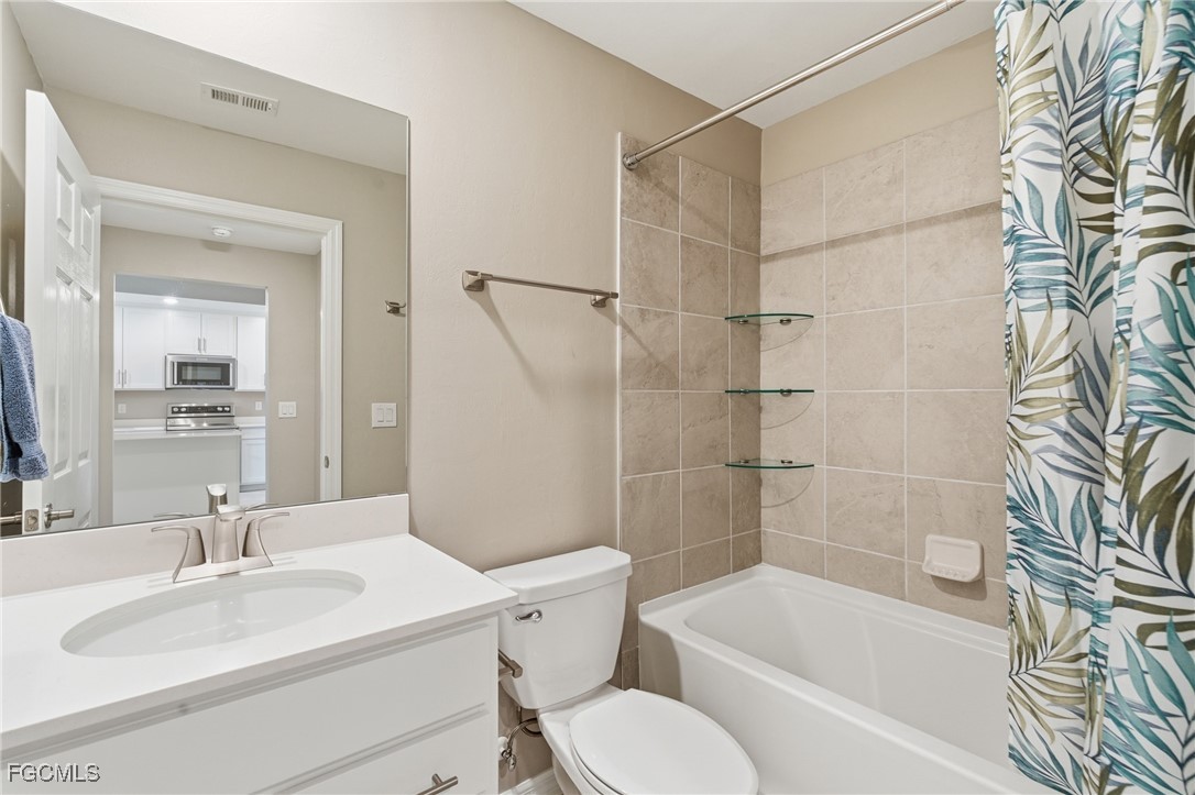 44000 Boardwalk Loop, Unit 1312 Punta Gorda, FL 33982 - Photo 31 of 48 a bathroom with a sink toilet and shower