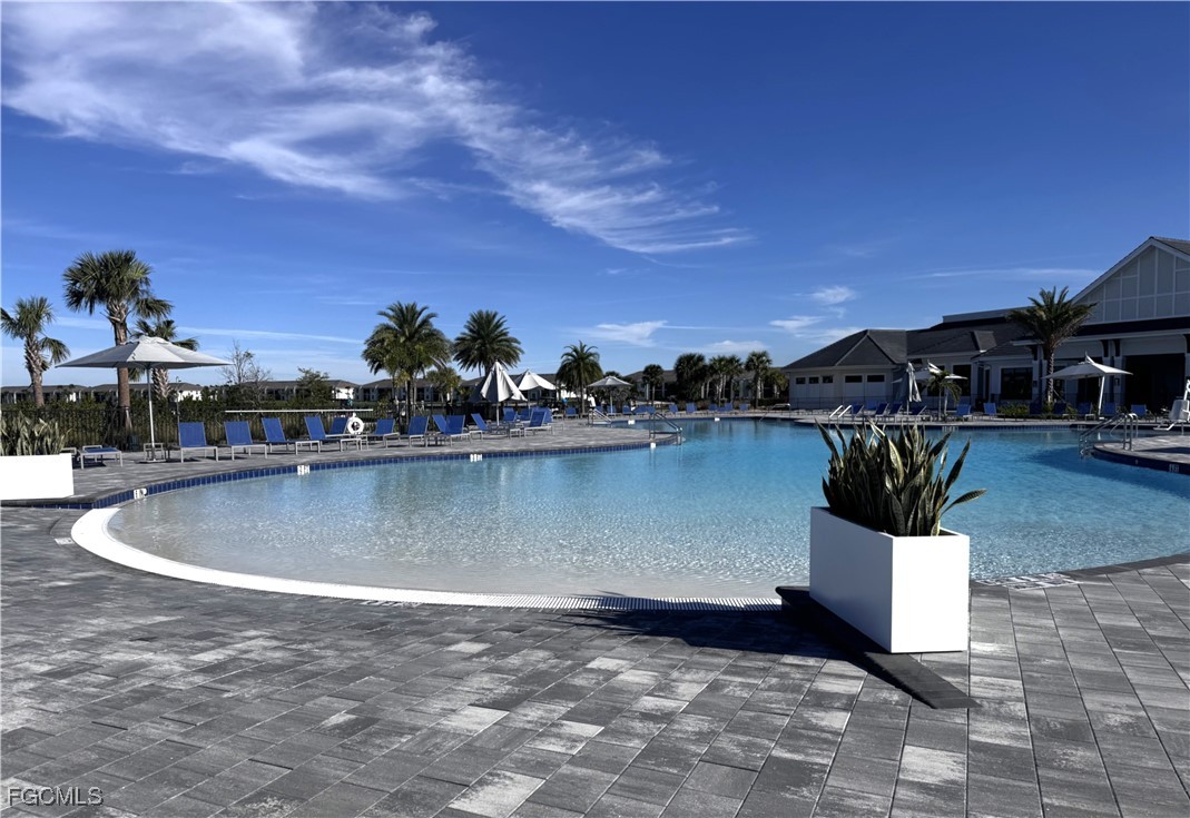 44000 Boardwalk Loop, Unit 1312 Punta Gorda, FL 33982 - Photo 39 of 48 a view of a swimming pool and an outdoor seating