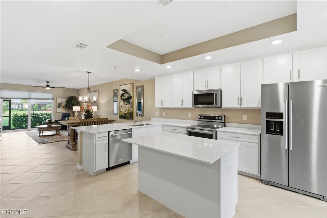 44000 Boardwalk Loop, Unit 1312 Punta Gorda, FL 33982 - Photo 4 of 48 a kitchen with sink cabinets and stainless steel appliances