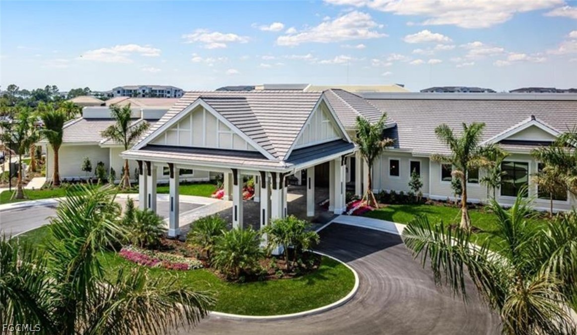 44000 Boardwalk Loop, Unit 1312 Punta Gorda, FL 33982 - Photo 48 of 48 a front view of a house with a garden and plants