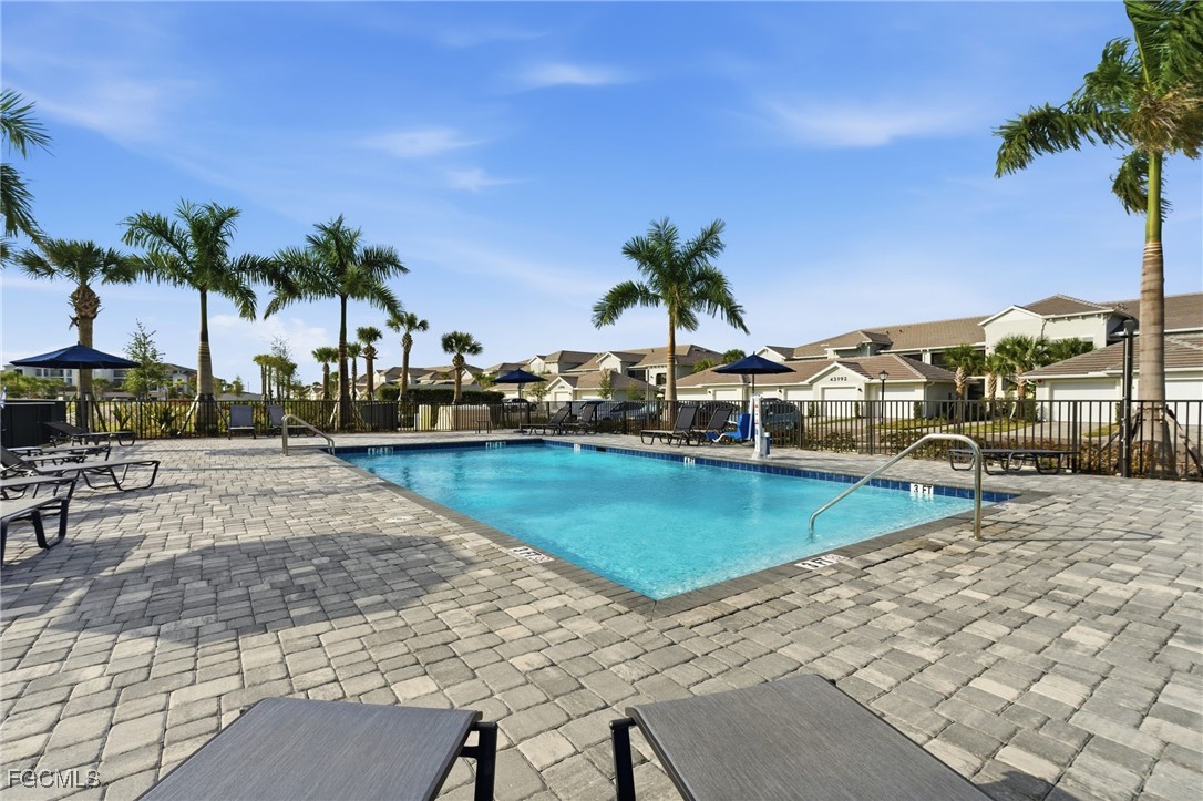 44000 Boardwalk Loop, Unit 1312 Punta Gorda, FL 33982 - Photo 7 of 48 a view of a swimming pool with an outdoor seating