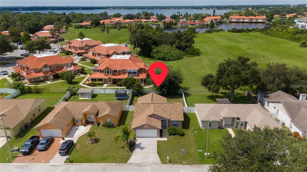 871 Reflections Loop East Winter Haven, FL 33884 - Photo 16 of 23 an aerial view of a house with yard swimming pool and outdoor seating