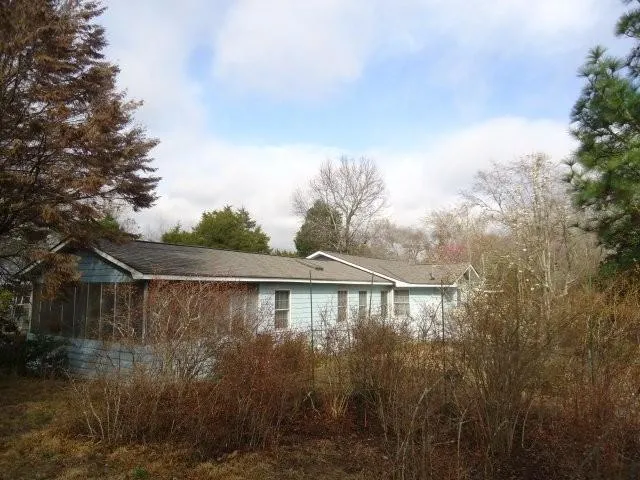a view of a house with a garden