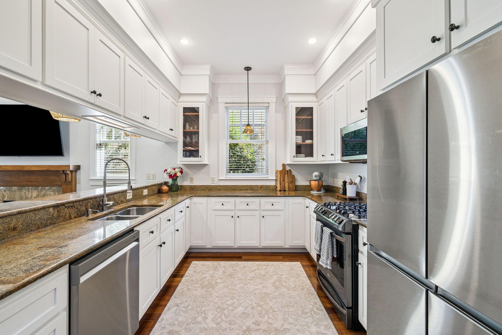 1237 Prospect Promenade Panama City Beach, FL 32413 - Photo 11 of 50 a kitchen with stainless steel appliances granite countertop a refrigerator sink and cabinets