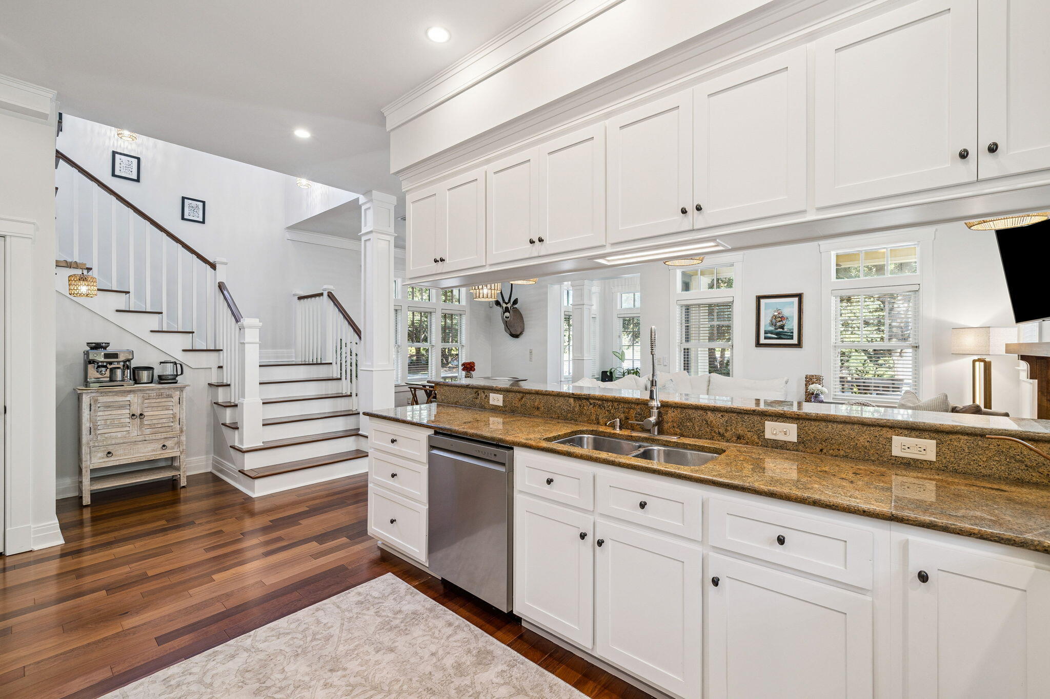 1237 Prospect Promenade Panama City Beach, FL 32413 - Photo 12 of 50 a kitchen with cabinets and wooden floor