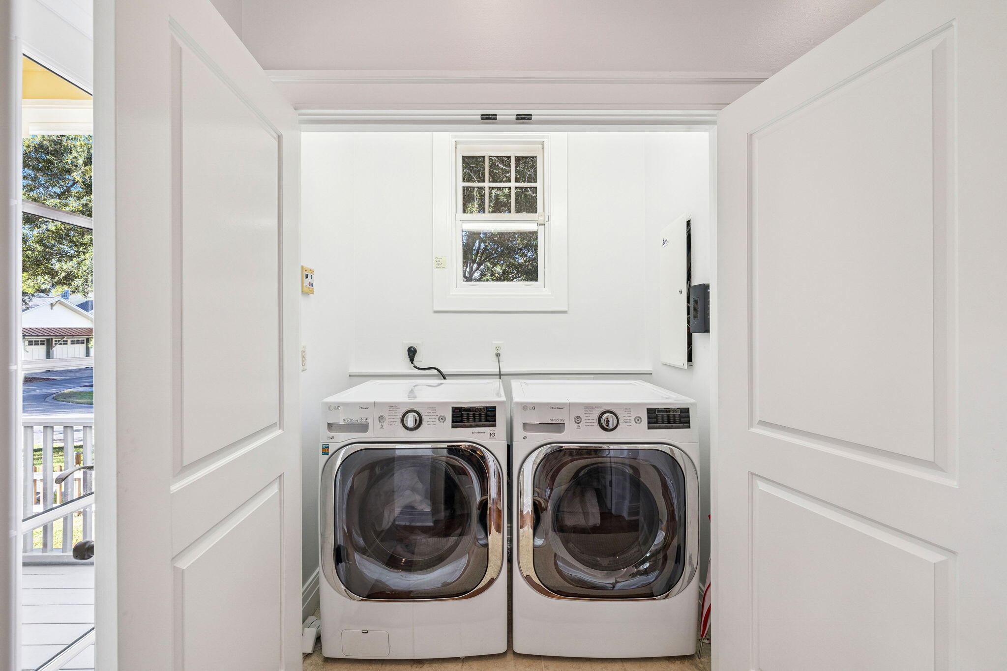 1237 Prospect Promenade Panama City Beach, FL 32413 - Photo 18 of 50 a utility room with dryer and washer