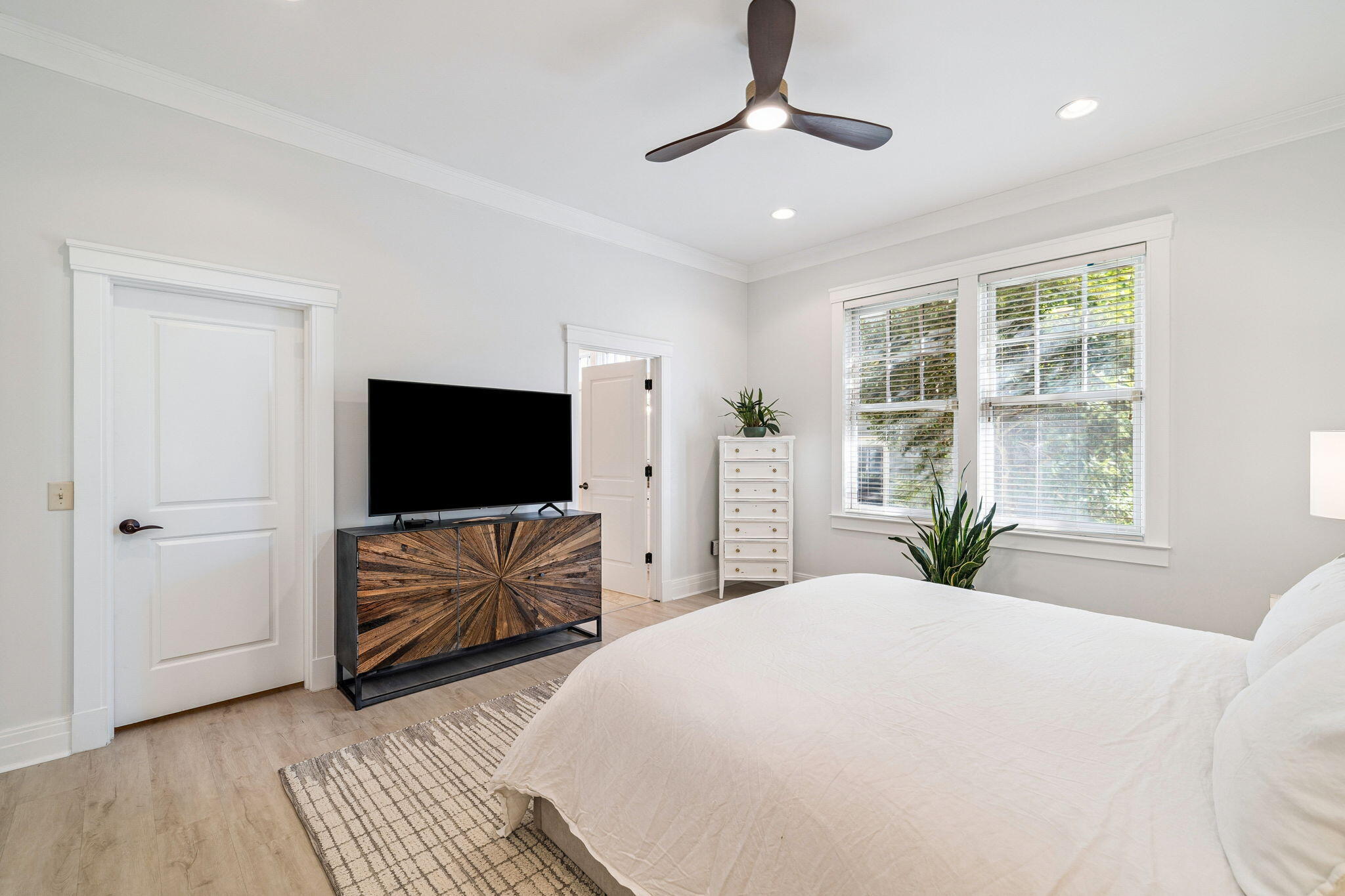 1237 Prospect Promenade Panama City Beach, FL 32413 - Photo 22 of 50 a bedroom with a bed and a flat screen tv