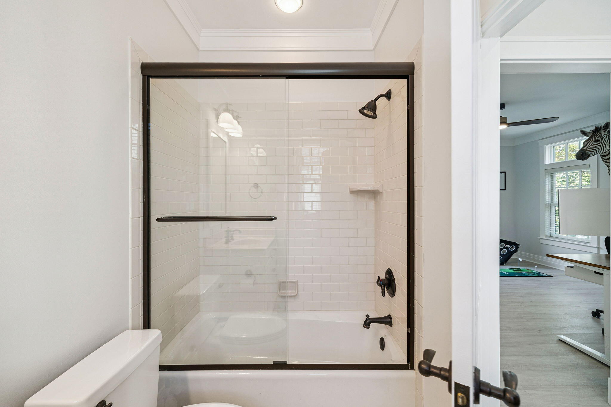 1237 Prospect Promenade Panama City Beach, FL 32413 - Photo 34 of 50 a bathroom with a glass shower door