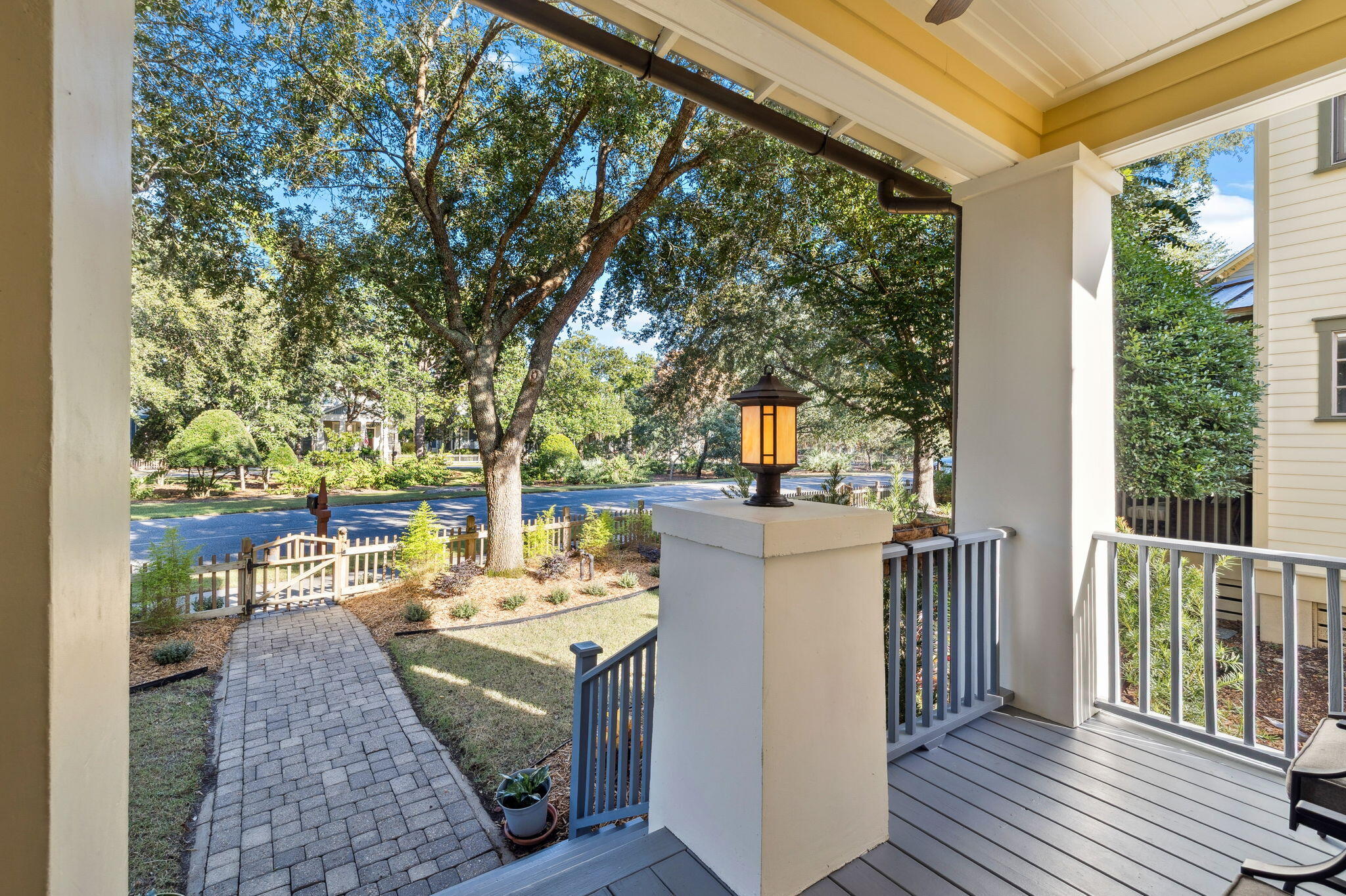 1237 Prospect Promenade Panama City Beach, FL 32413 - Photo 4 of 50 a view of a patio with table and chairs and potted plants