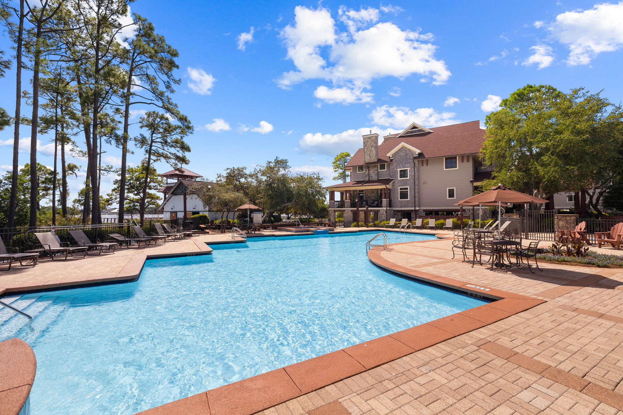 1237 Prospect Promenade Panama City Beach, FL 32413 - Photo 45 of 50 a view of a house with swimming pool and sitting area