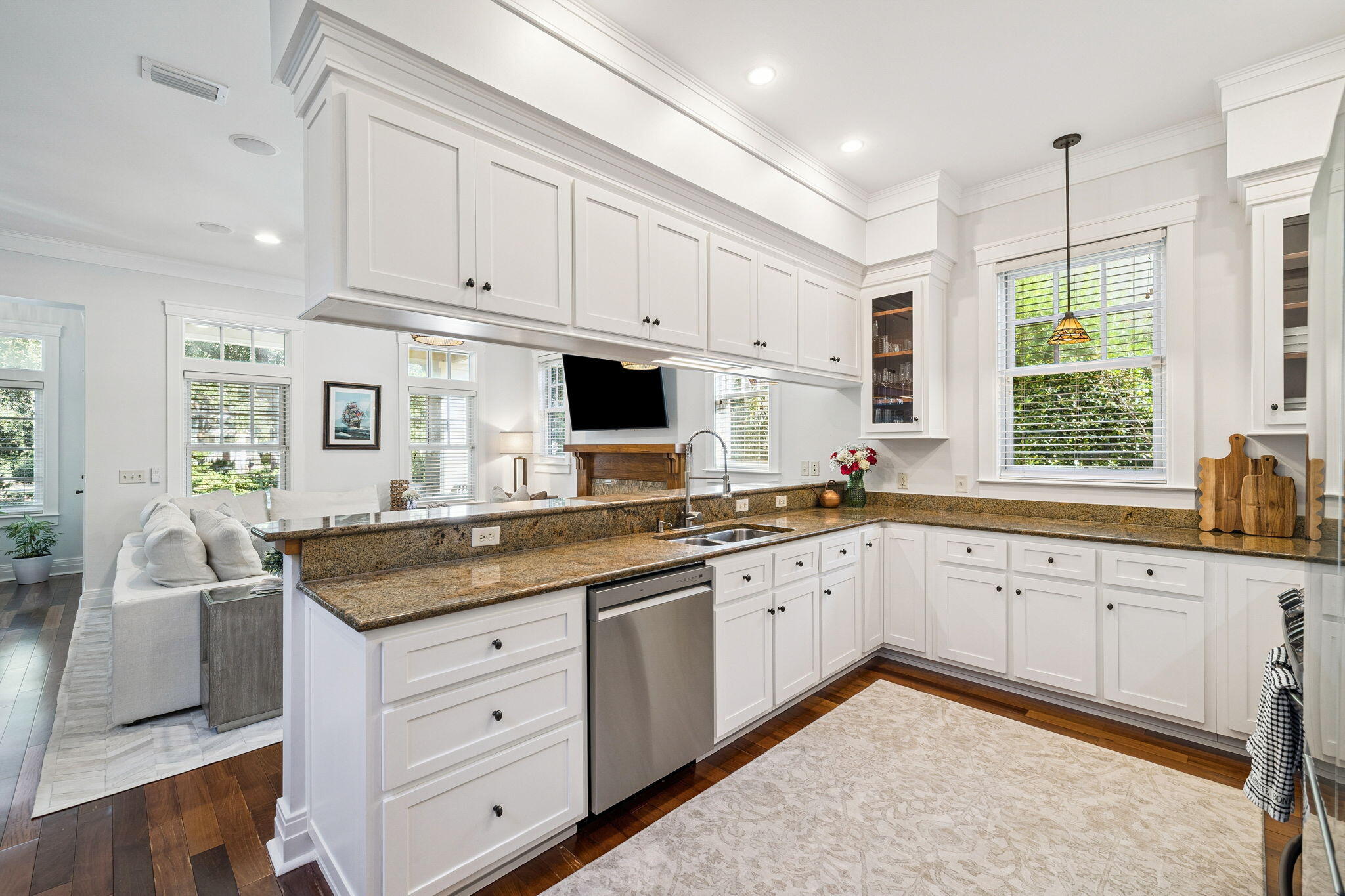 1237 Prospect Promenade Panama City Beach, FL 32413 - Photo 10 of 50 a kitchen with granite countertop white cabinets white appliances and sink