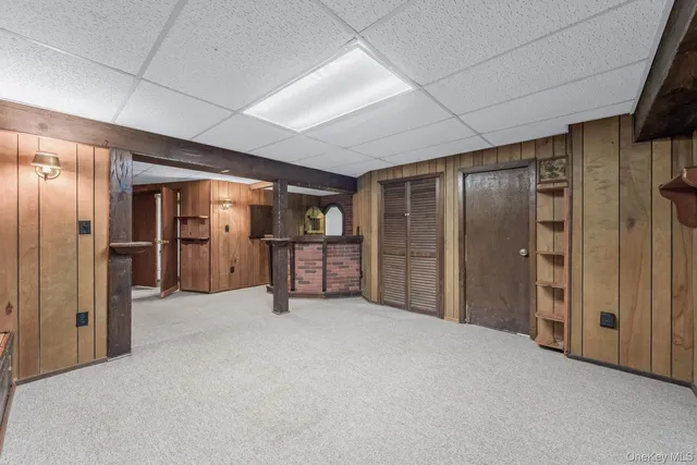 a view of an empty room with closet