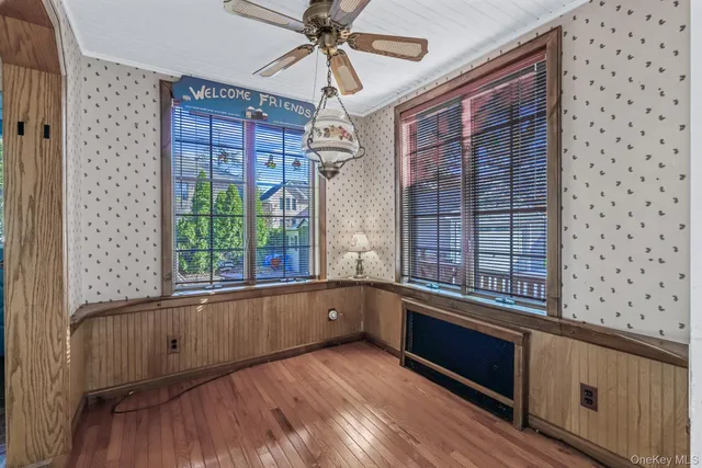 a view of a large window with wooden floor
