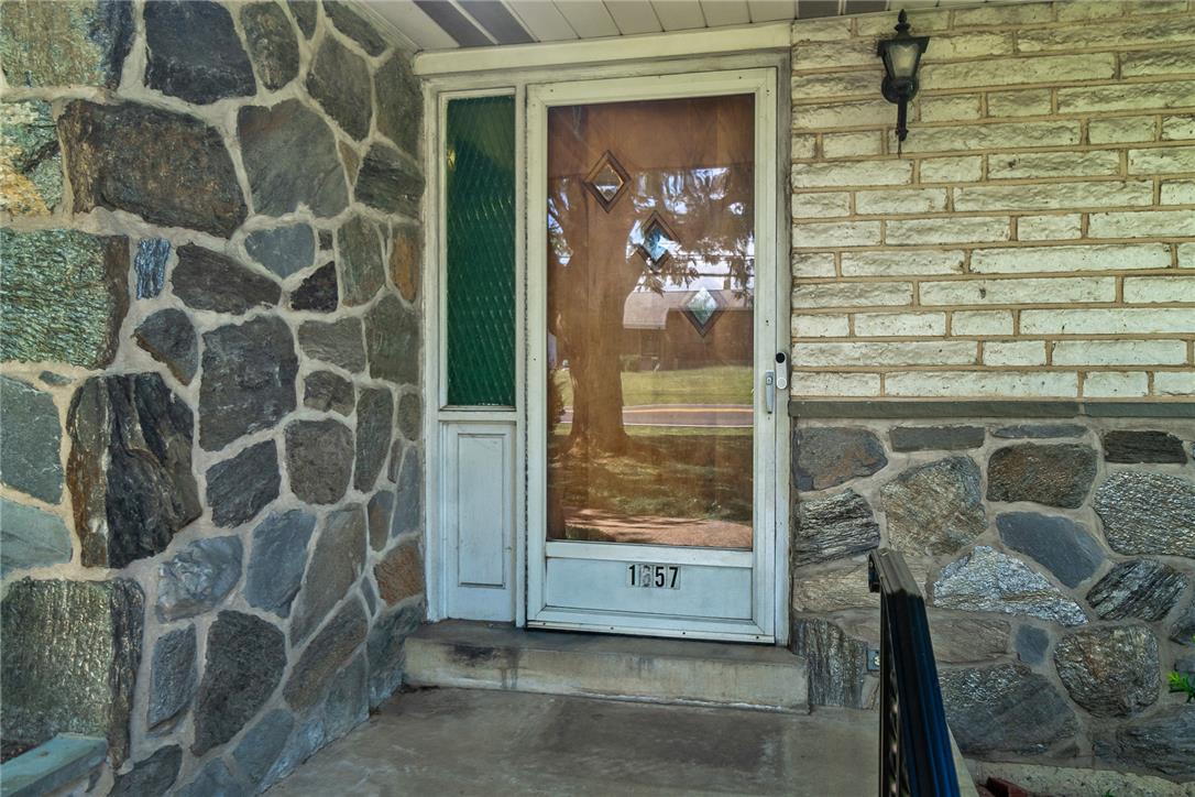 1657 Clearview Road Coplay, PA 18037 - Photo 30 of 77 A welcoming entry features a stone and brick facade, creating compelling curb appeal.