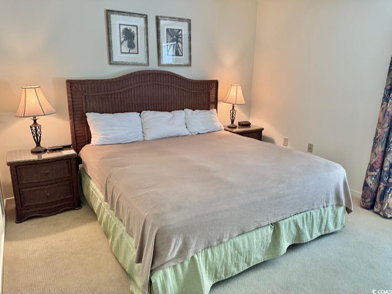 404 Melrose Place, Unit 21A Myrtle Beach, SC 29572 - Photo 18 of 30 Bedroom featuring light carpet and baseboards