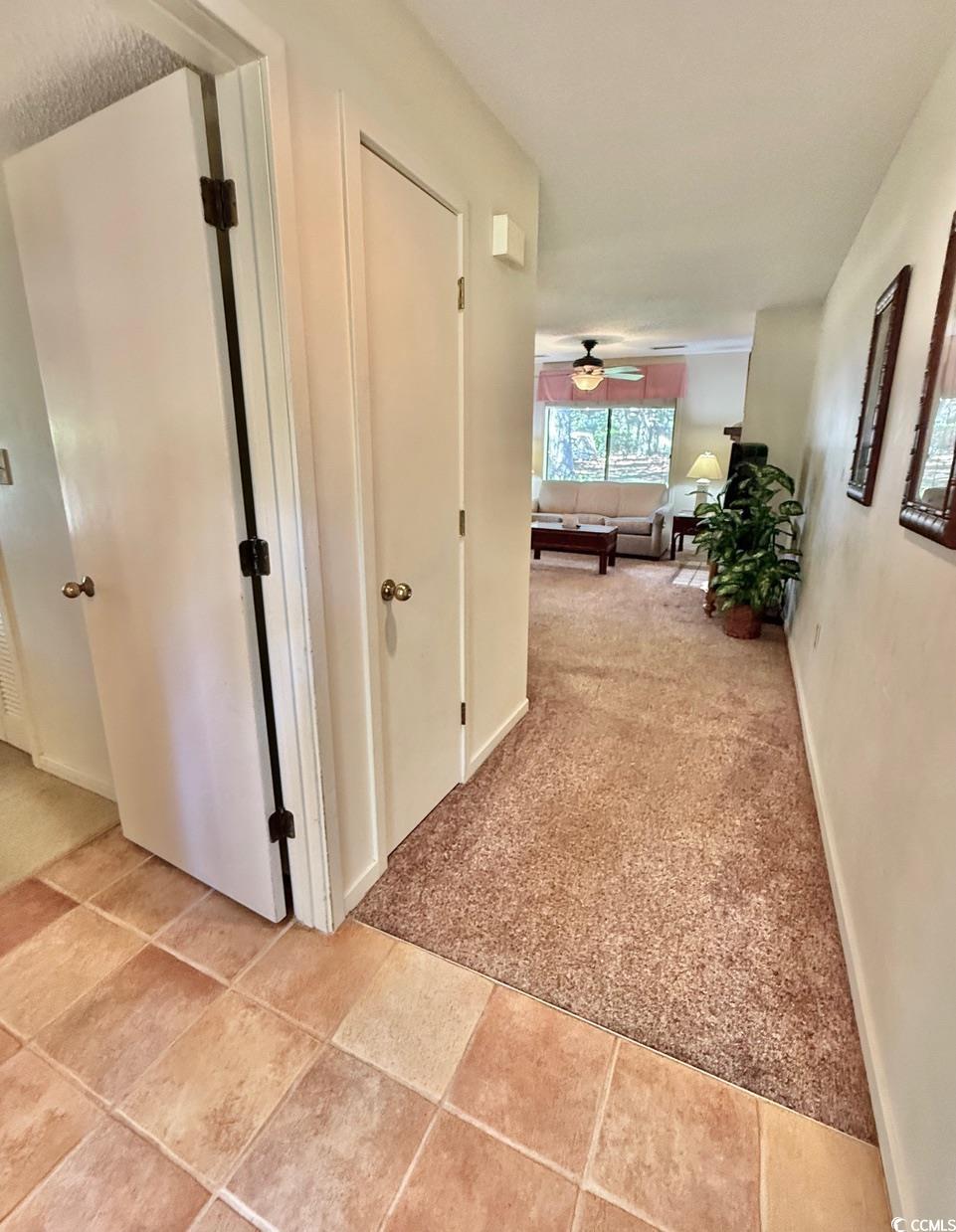 404 Melrose Place, Unit 21A Myrtle Beach, SC 29572 - Photo 2 of 30 Hall featuring light carpet and light tile patterned floors