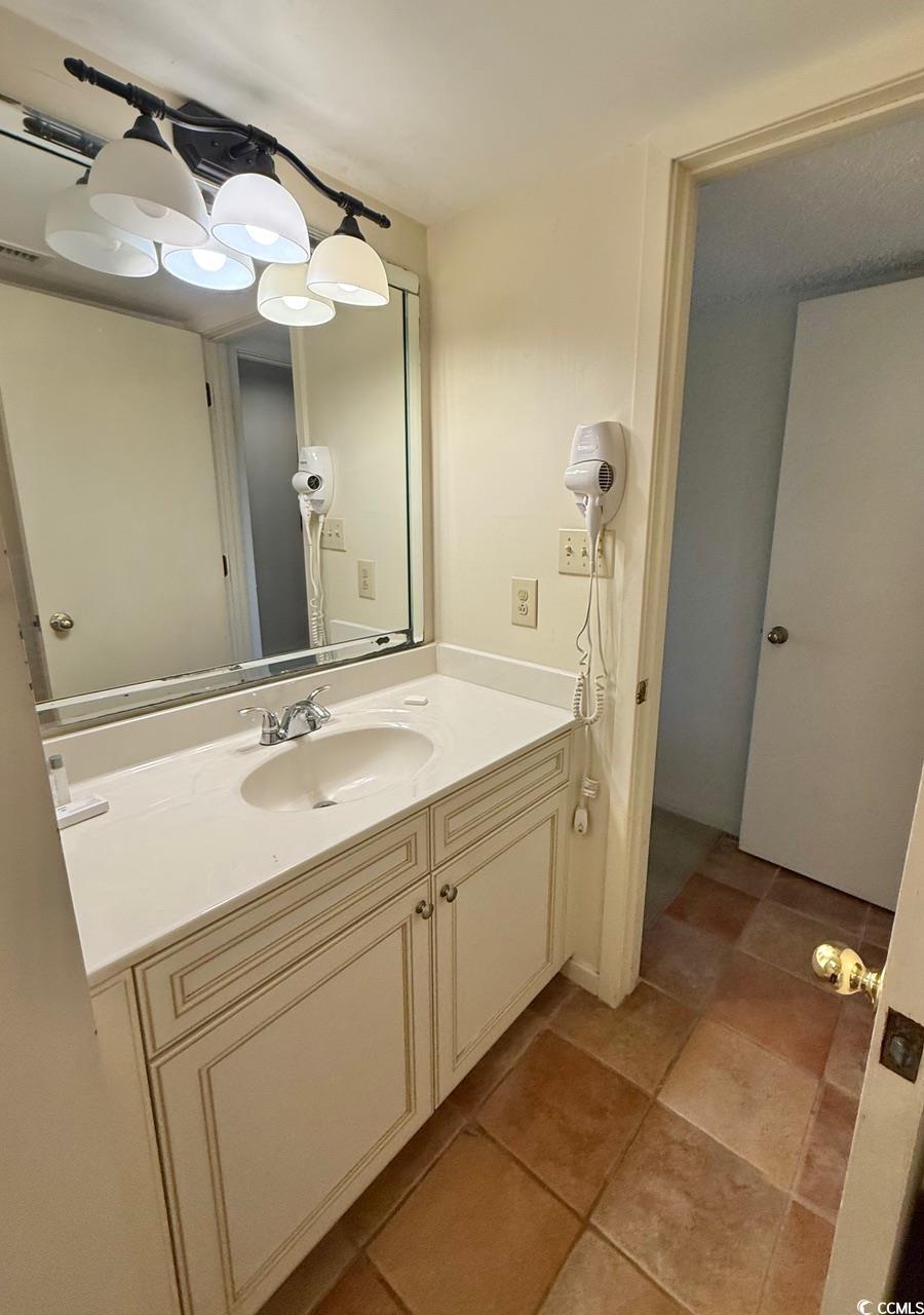 404 Melrose Place, Unit 21A Myrtle Beach, SC 29572 - Photo 22 of 30 Bathroom with vanity and light tile patterned floors