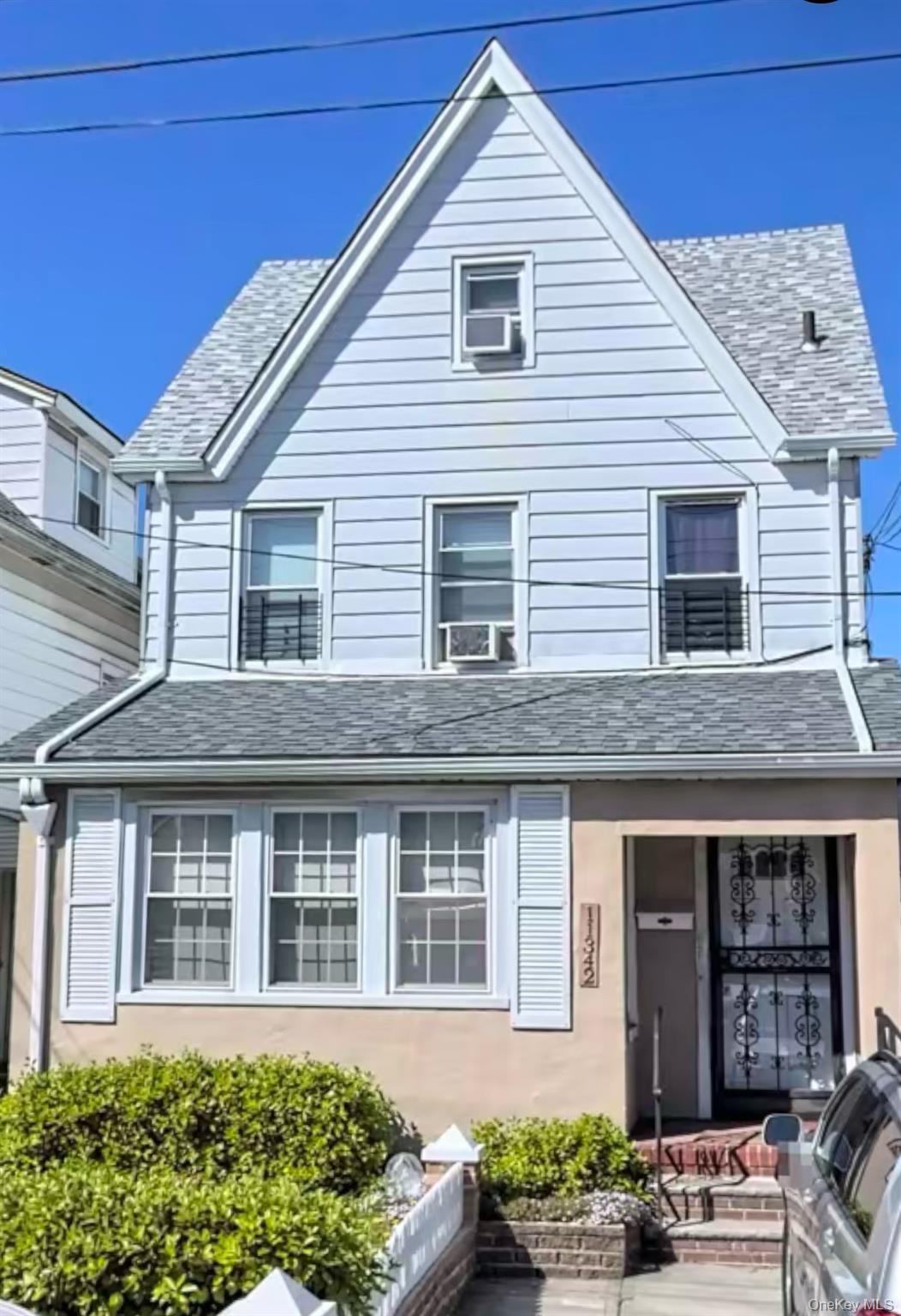 a view of a house with potted plants