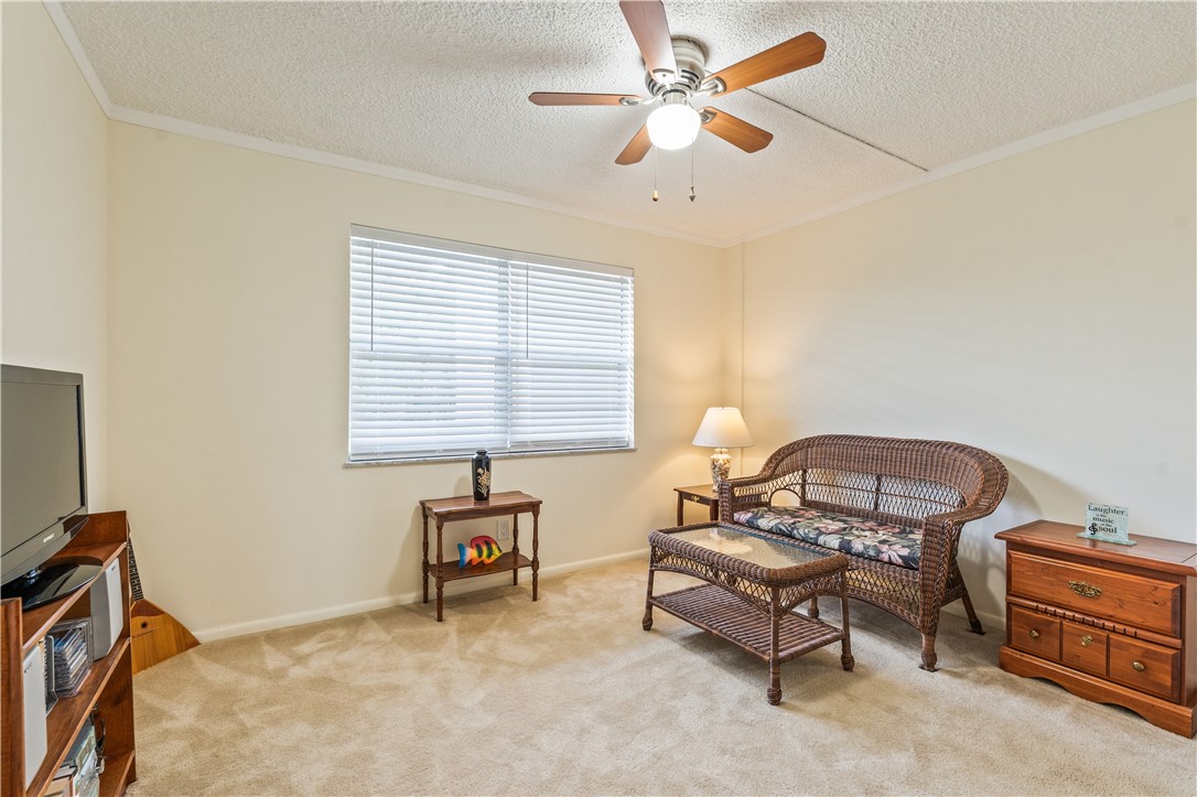 275 Date Palm Road, Unit 403 Vero Beach, FL 32963 - Photo 20 of 35 a bedroom with furniture and a window